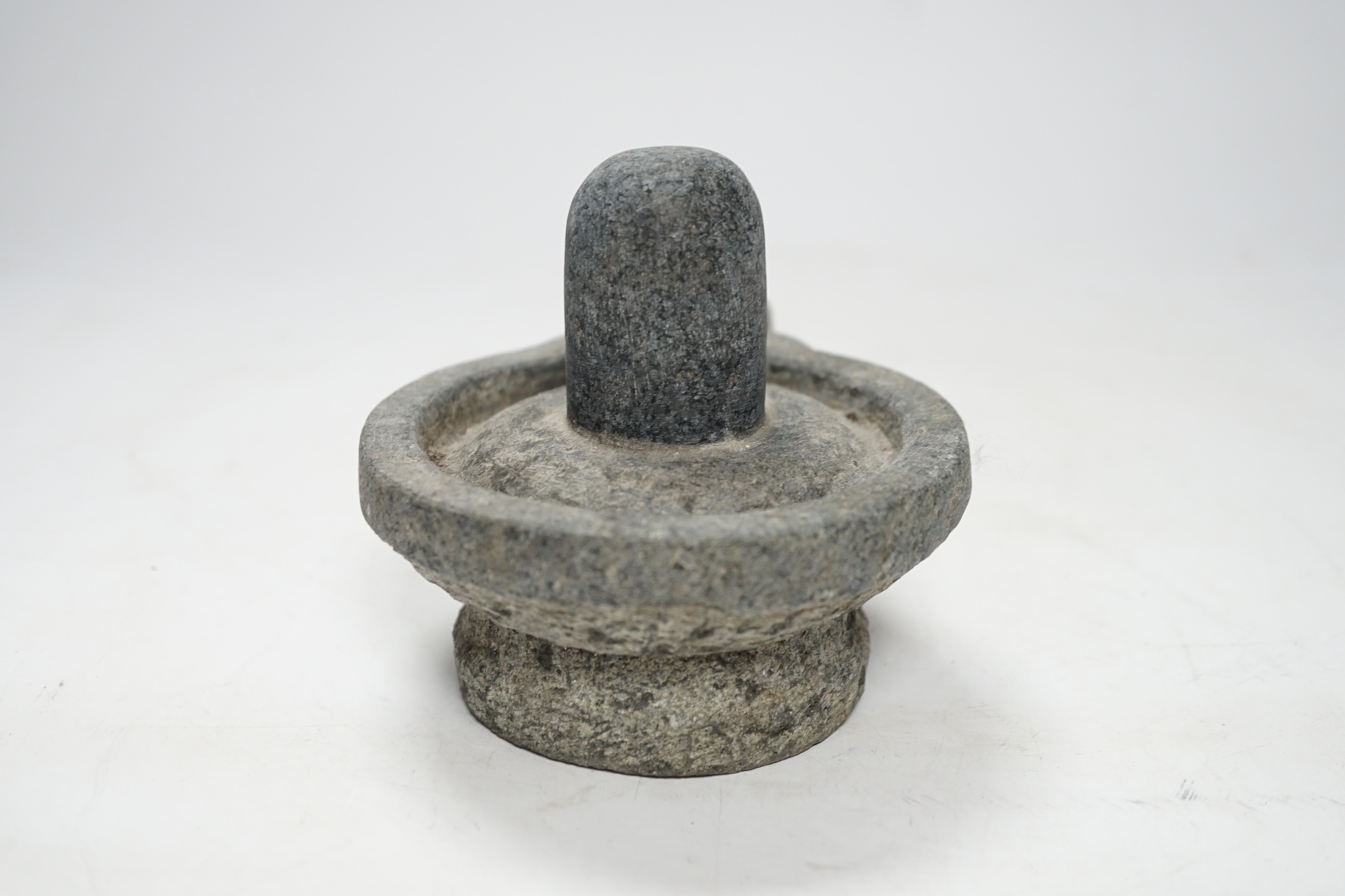 A granite Hindu Shiva Lingham, 11cm high